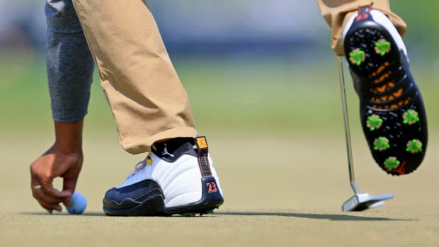 Harold Varner III's white and black Air Jordan golf shoes.